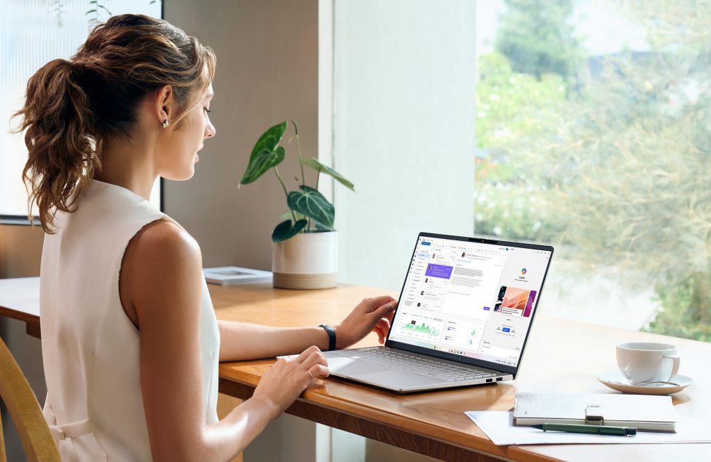 A woman sitting in front of a laptop.